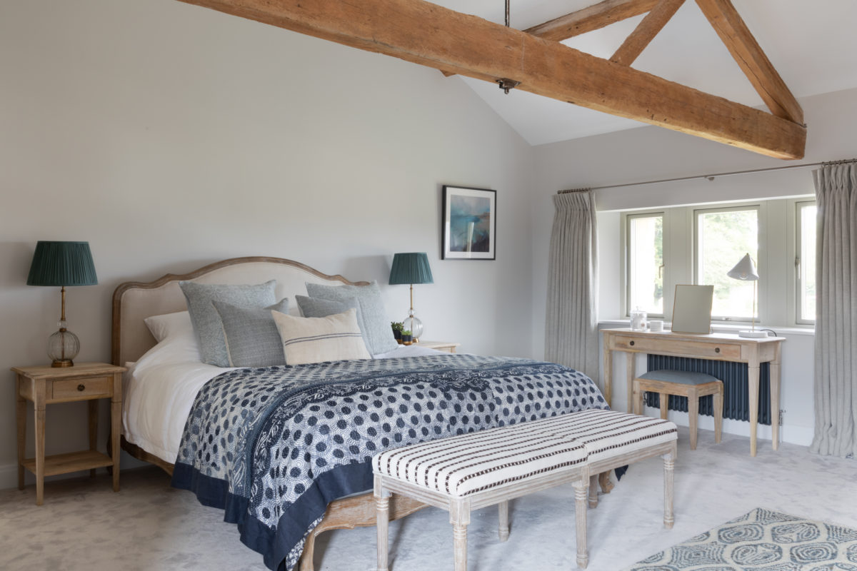 Signet Hill Barn-20 Blue and grey bedroom in Cotswold modern stone barn conversion