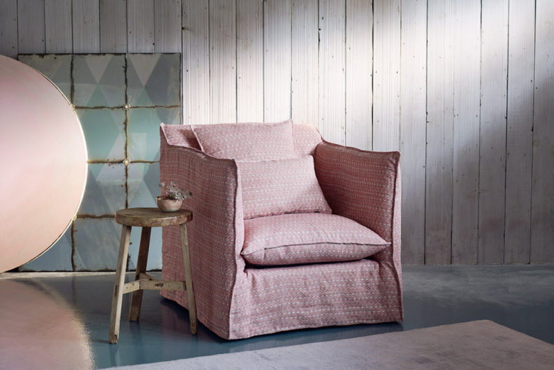 loose cover on a arm chair in a pink fermoie fabric