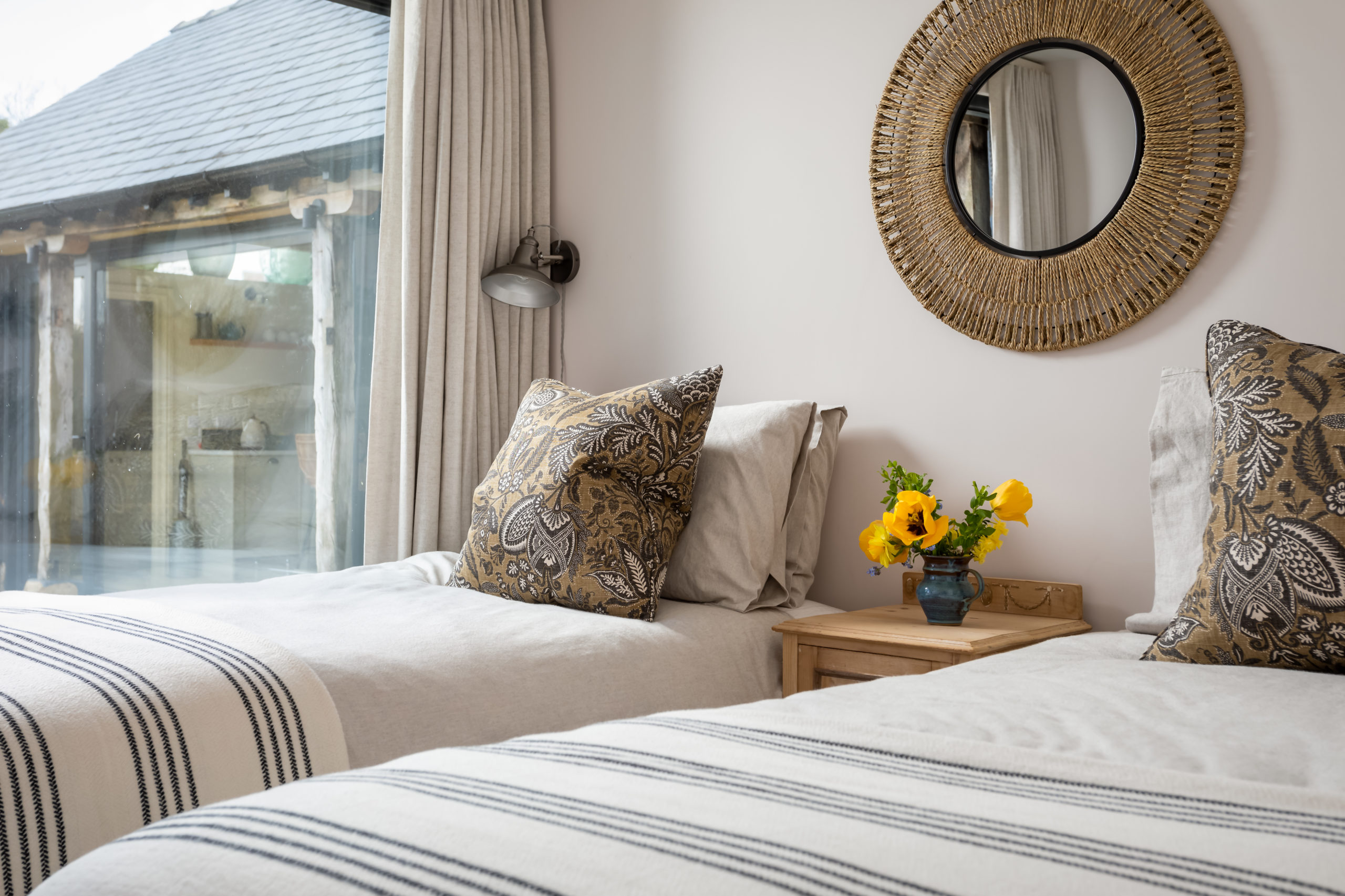 Twin bedroom in neutral and earth colours.