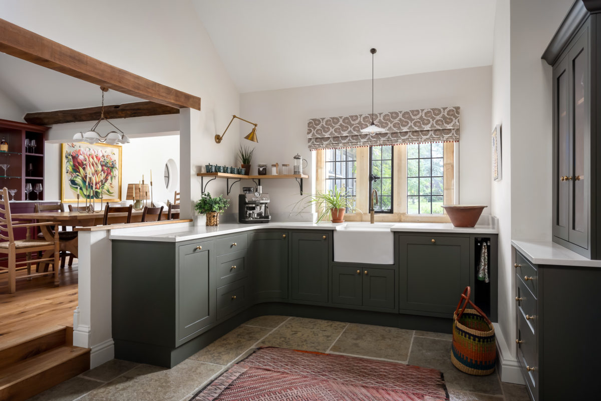 Olive green kitchen, Cotswold stone floor, Butlers sink, Quooker tap, ask beam, roman blind, Pooky wall lights