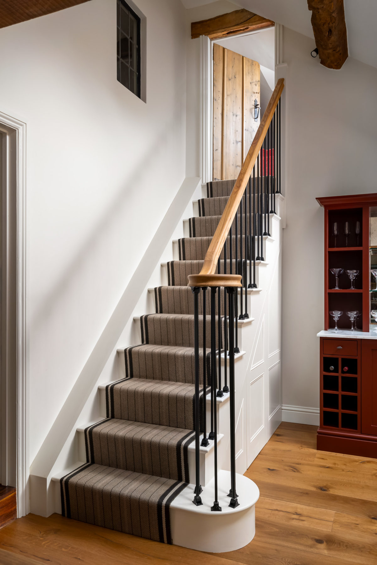 Contemporary metal and oak stair rail, Roger Oates stair runner, oak flooring