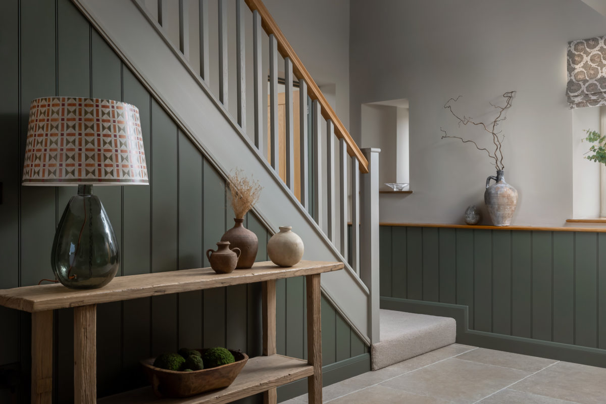 Hall in Farrow & Ball Hardwick White, oak console table & lamp. Stone floor